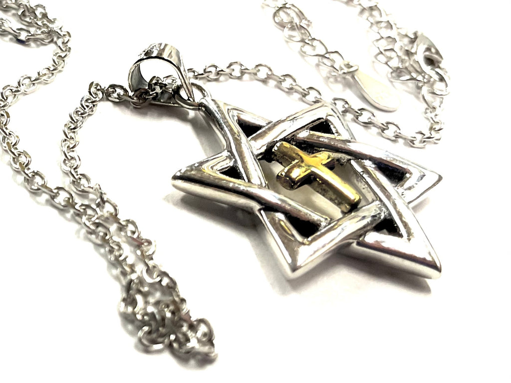 Close-up silver Star of David pendant with gold inlaid cross centerpiece