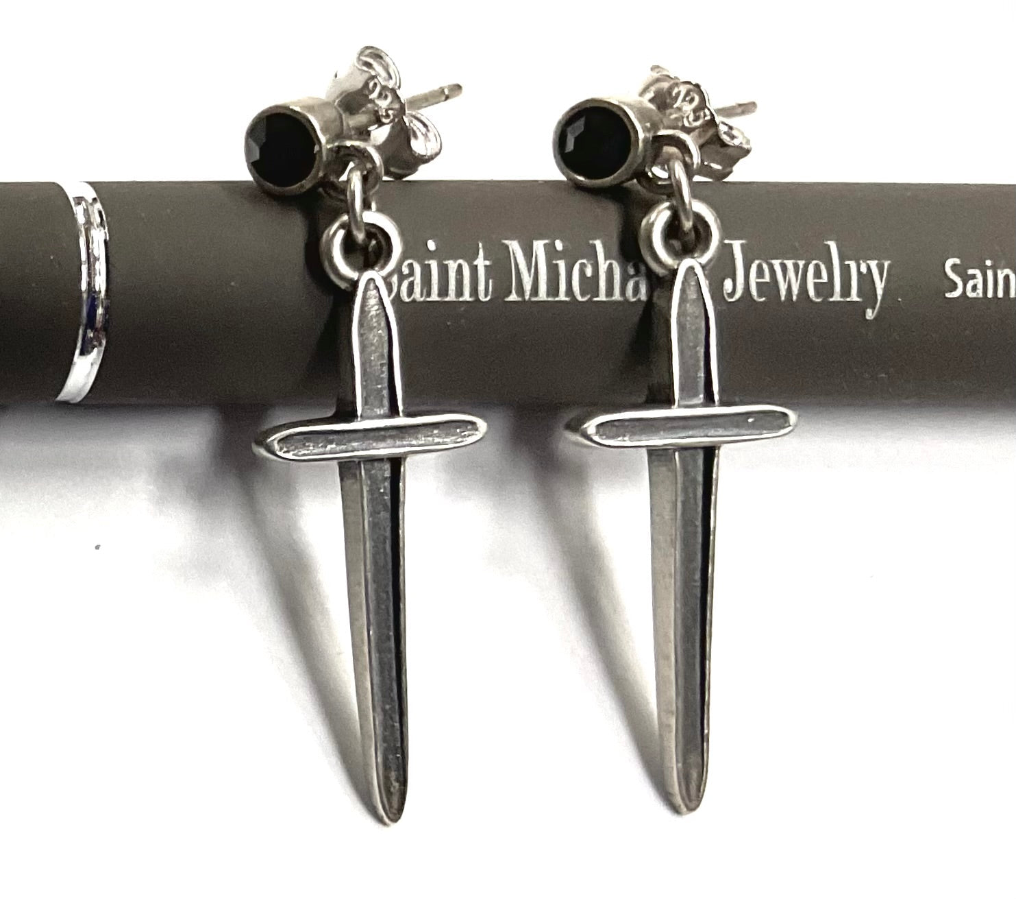 Sterling silver earrings with black onyx studs and long dagger dangle pendants
