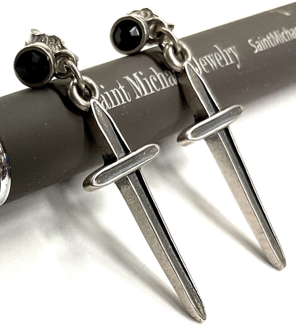 Sterling silver dangle earrings with black onyx studs and dagger-shaped drops