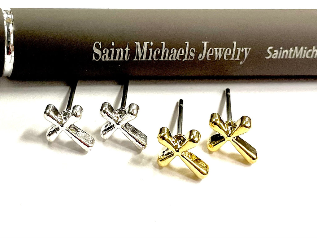 Silver cross stud earrings with modern flowing curved cross detailing