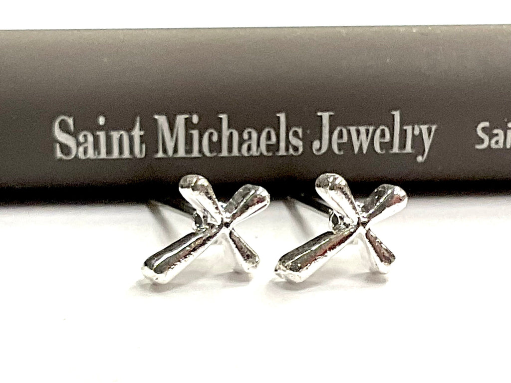 Silver cross stud earrings with a modern flowing curved cross design