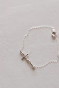 Silver cross bracelet with cross pendant, fine chain, and round clasp