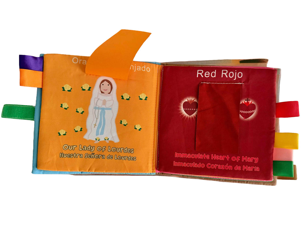 Open fabric Mary colors book set with red, orange, and illustrated page panels.