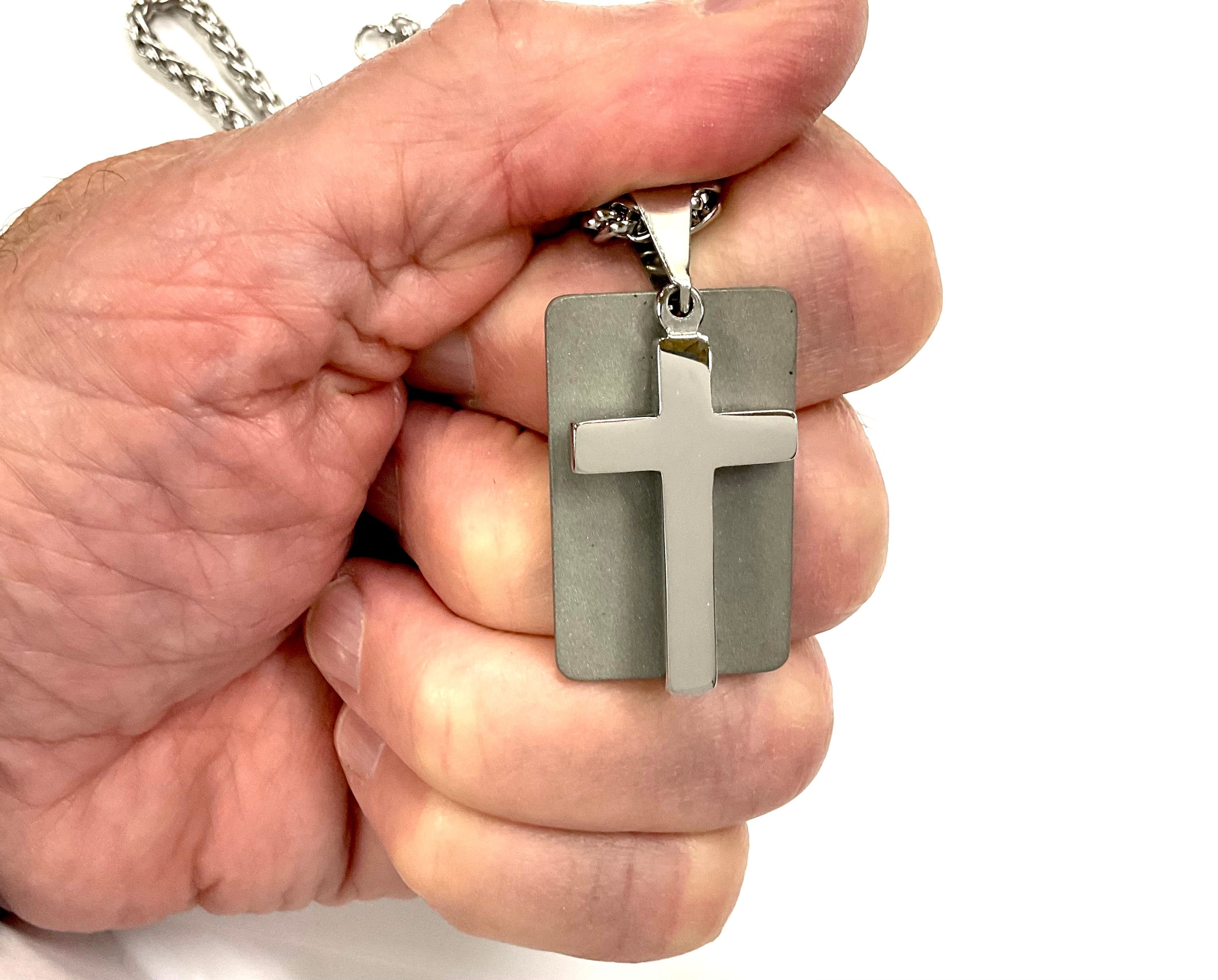Silver cross dog tag necklace pendant close-up with chain and cross