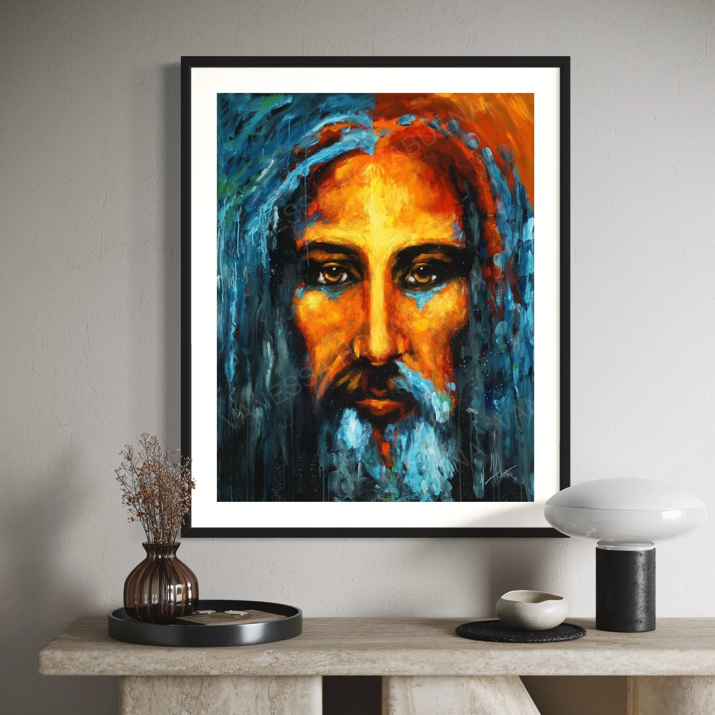 Framed portrait print with white mat of a bearded man in blue and orange