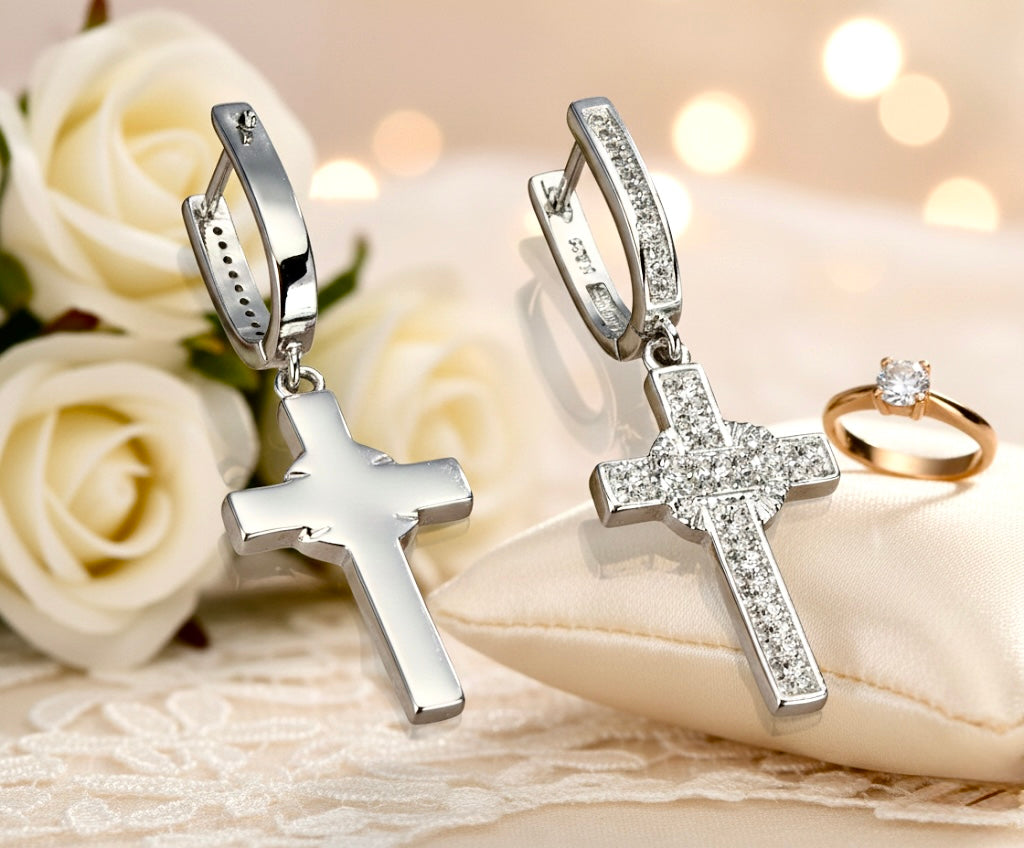 Sterling silver zircon cross drop earrings, two on display with clips
