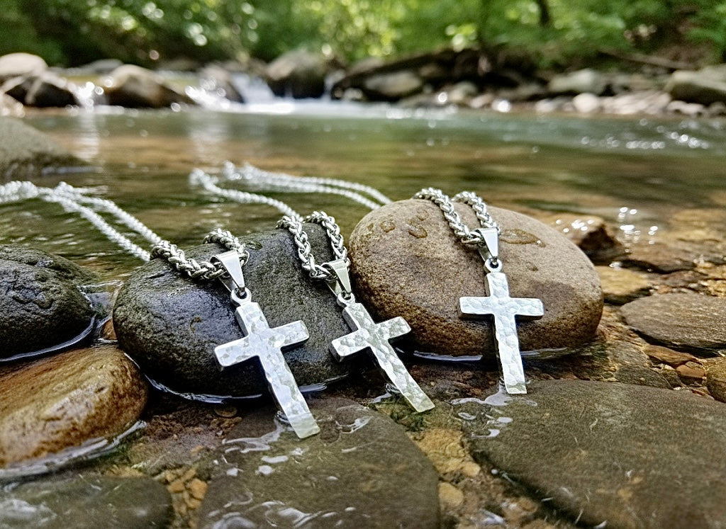 Silver cross pendant necklace with hammered texture and chain links
