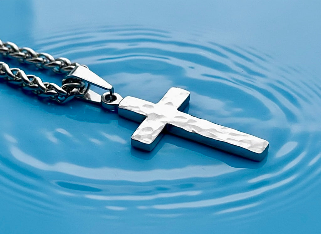 Silver cross pendant necklace with textured side and polished front