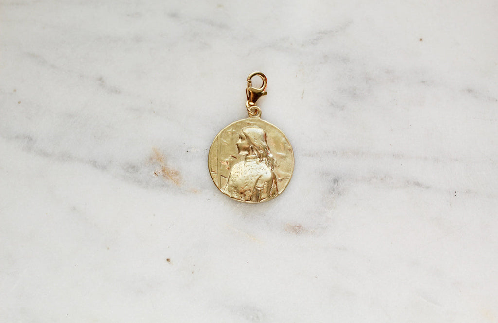 Gold St. Joan of Arc medallion pendant, round relief with small top loop bail