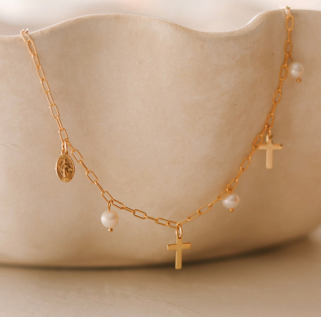 Gold cross and pearl charm necklace with adjustable chain