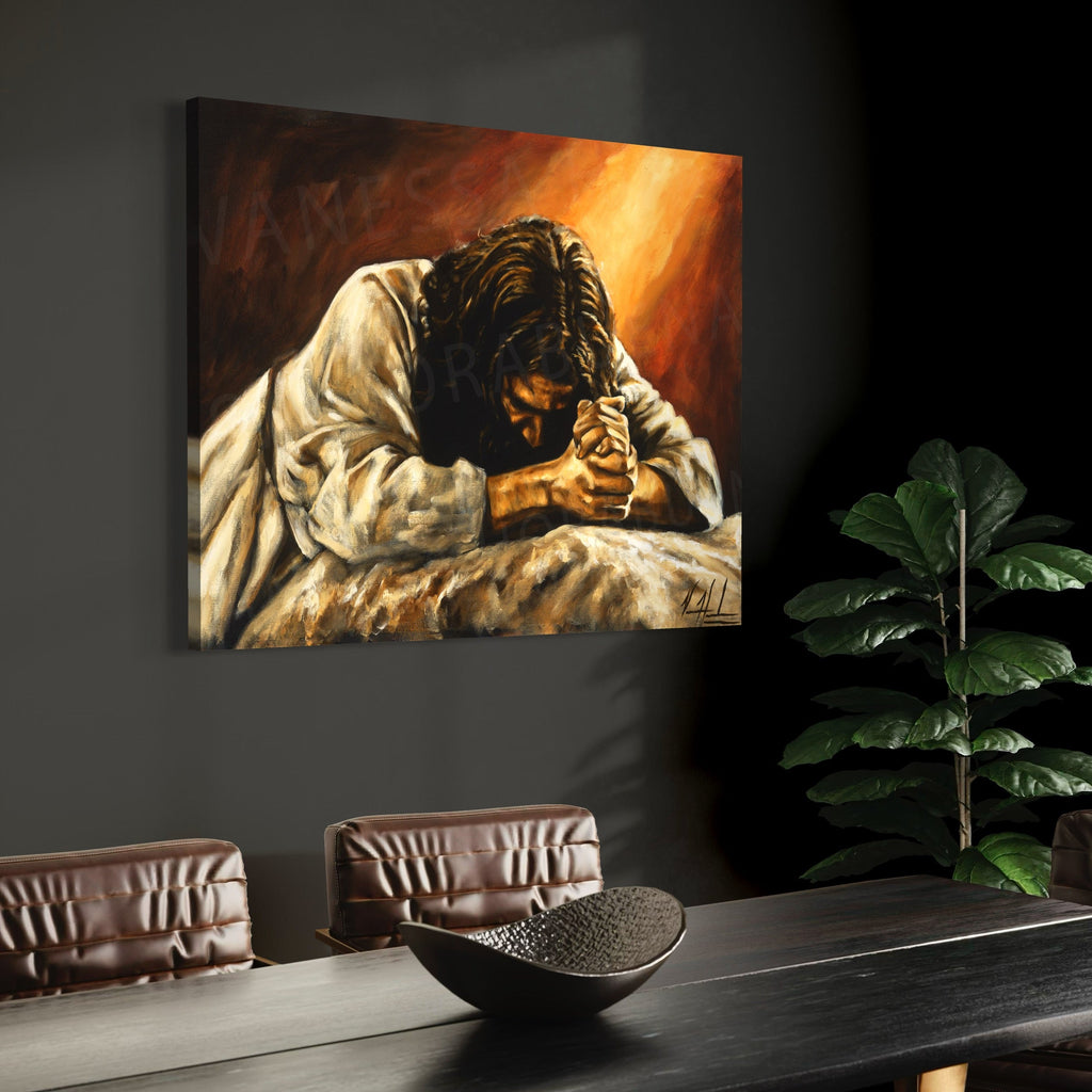 Framed giclée print of a praying man with clasped hands on a dark wall