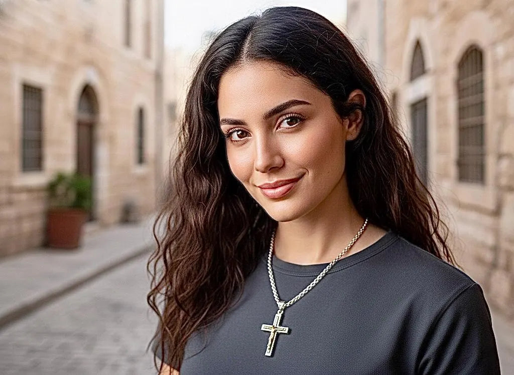 Crucifix cross pendant necklace in silver with small gold-tone detail on chain