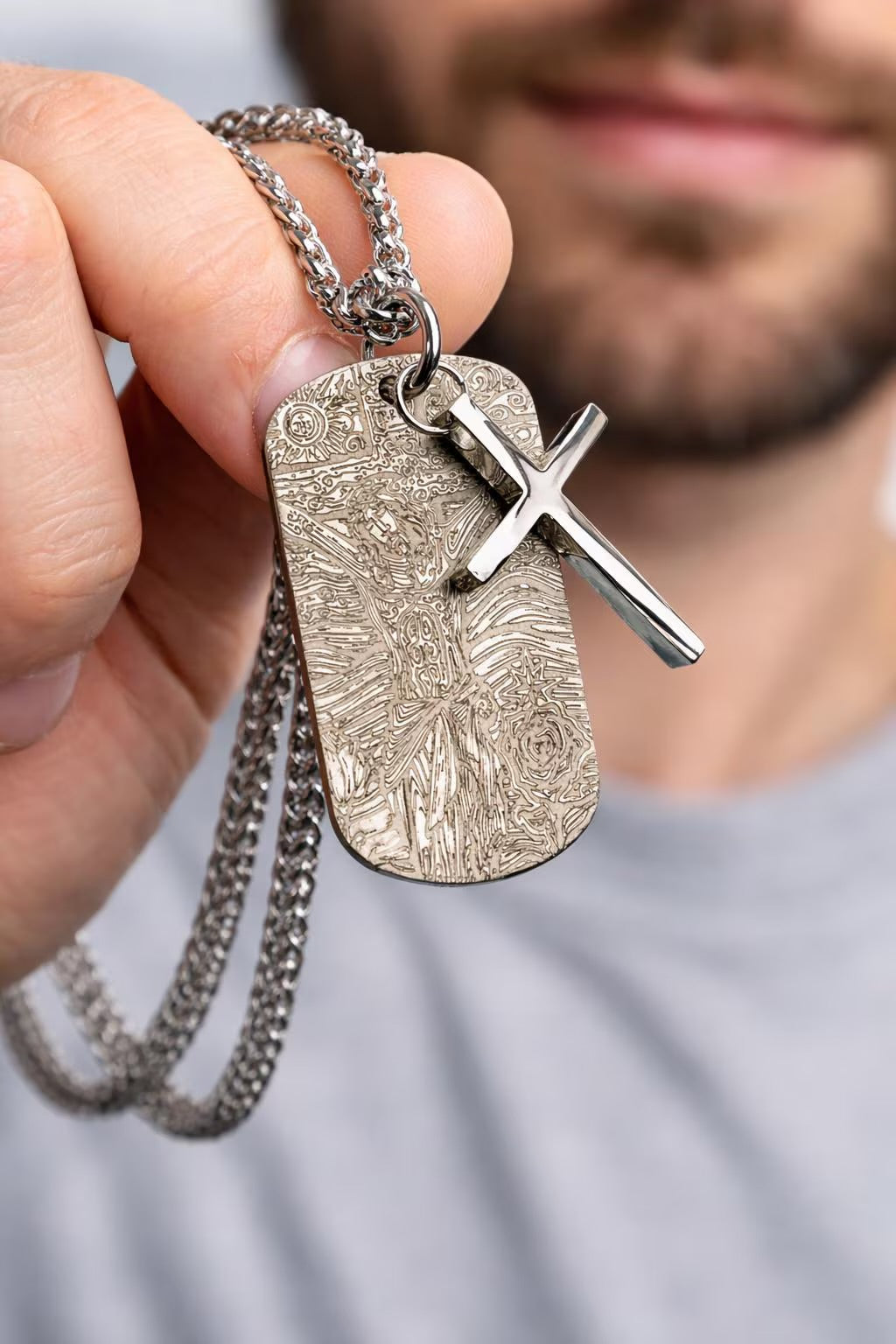 Engraved dog tag pendant with cross overlay and heavy keel chain, silver-toned