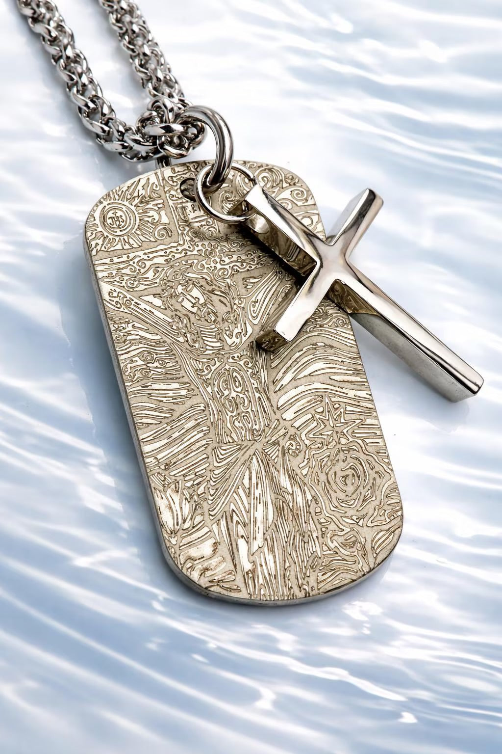 Engraved dog tag pendant with cross overlay on heavy chain, silver-toned
