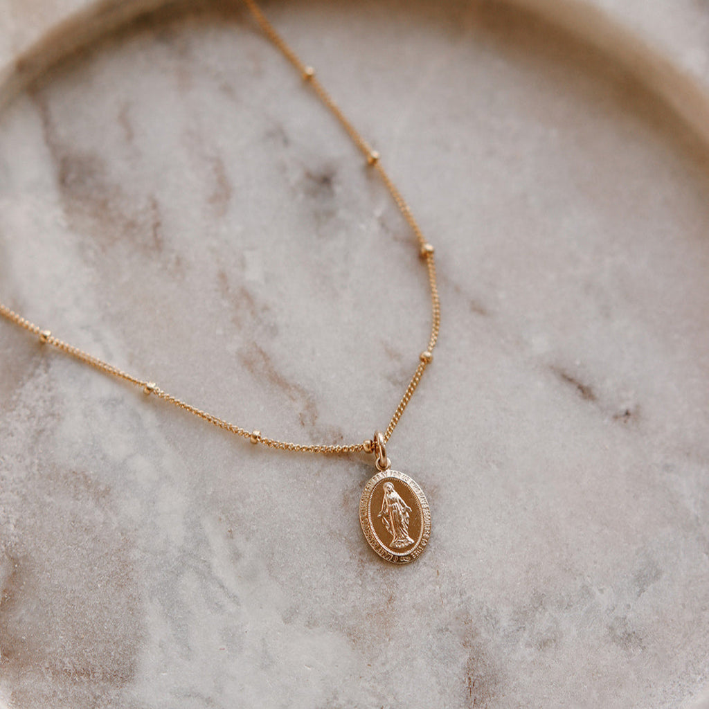 Gold-tone chain with oval Miraculous Medal pendant, Mary figure in relief