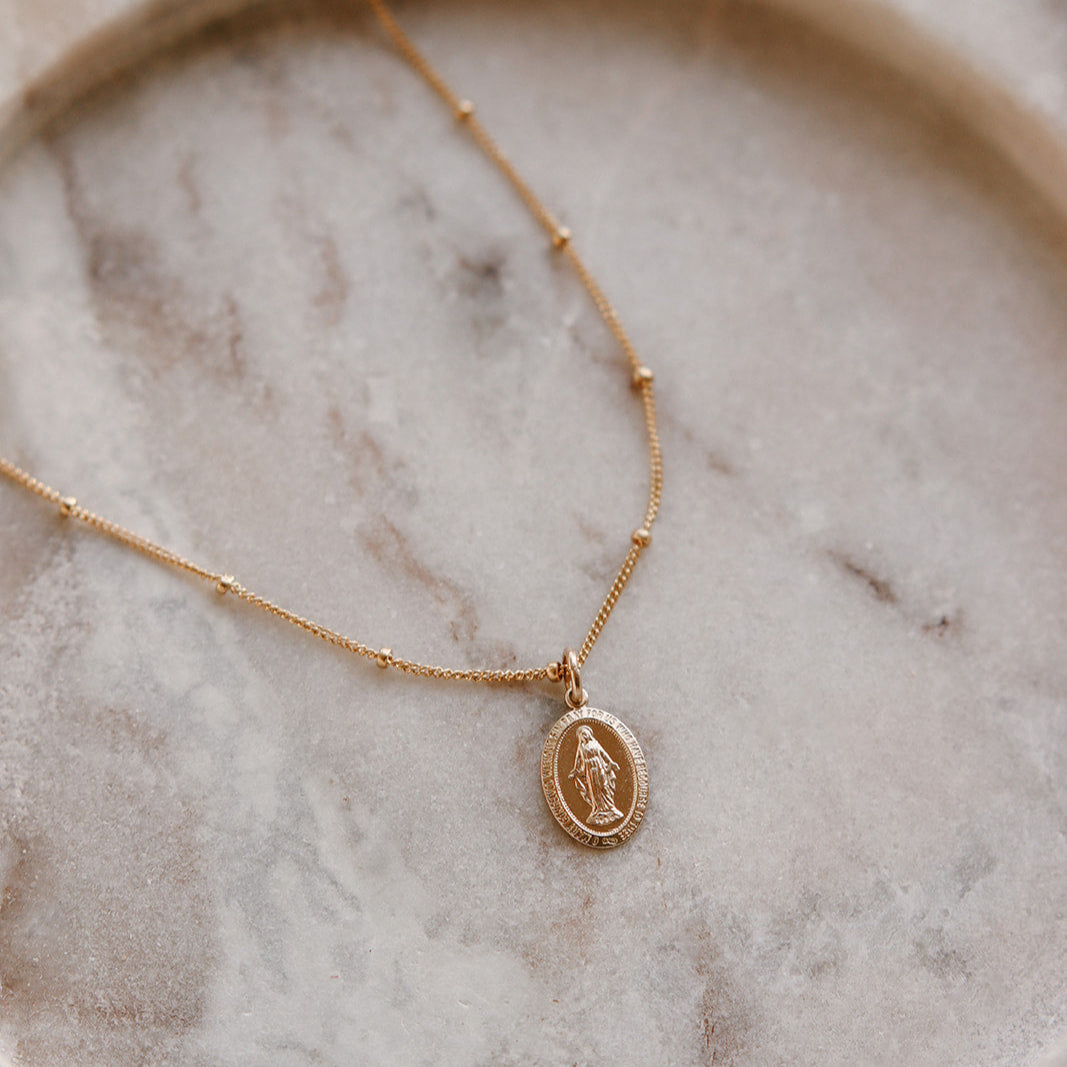 Gold-tone chain with oval Miraculous Medal pendant, Mary figure in relief