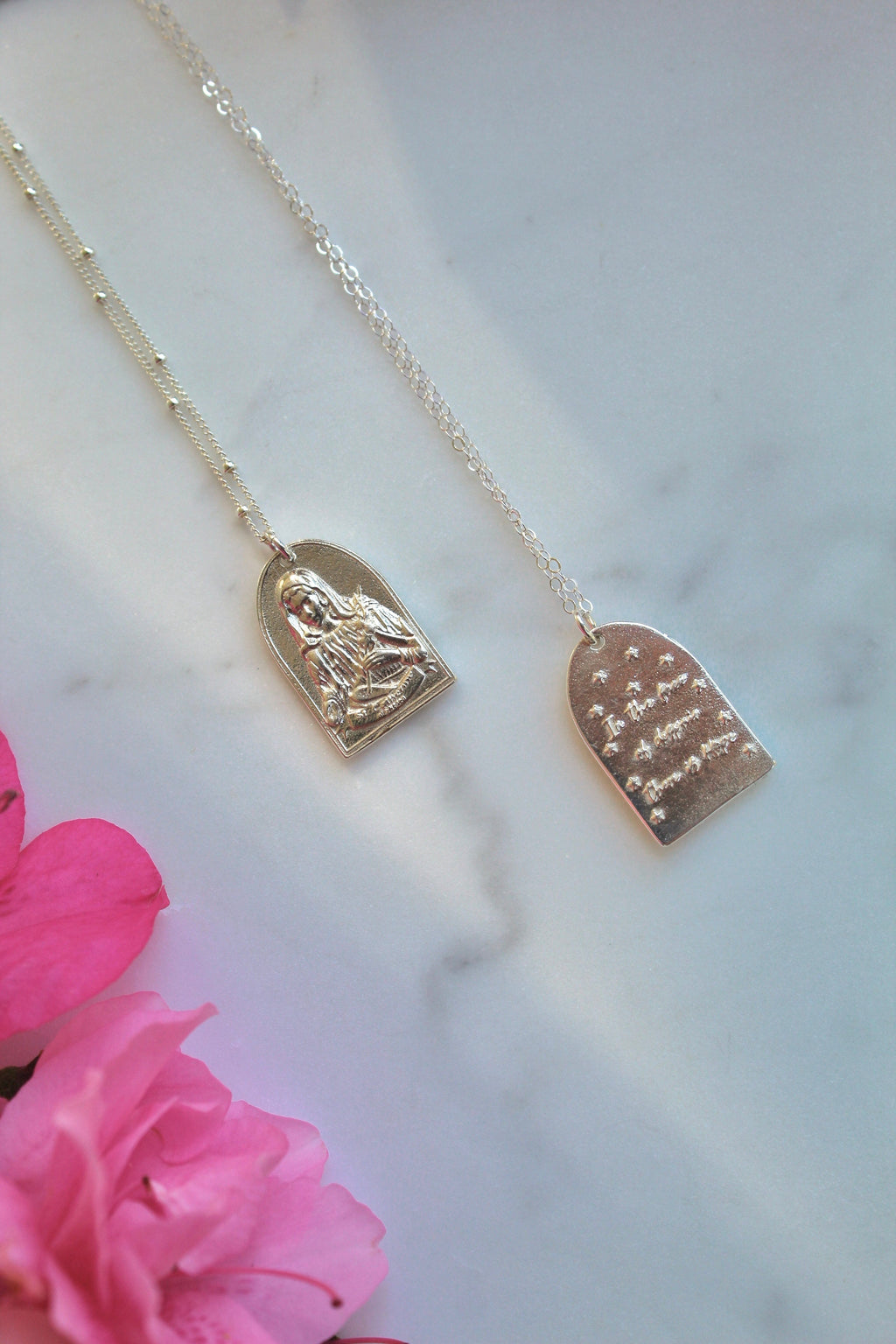 Sterling silver Saint pendant necklaces with oval pendants on thin chains