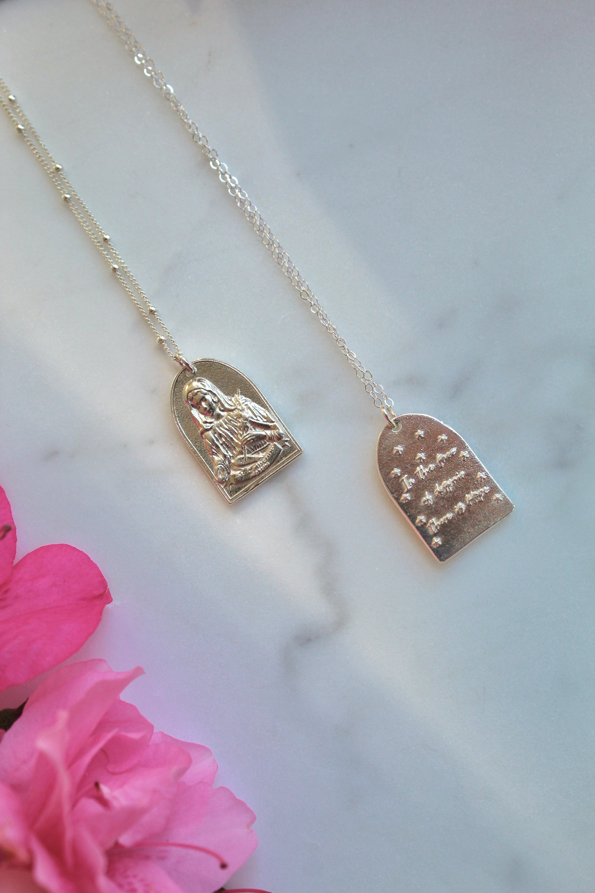 Sterling silver Saint pendant necklaces with oval pendants on thin chains