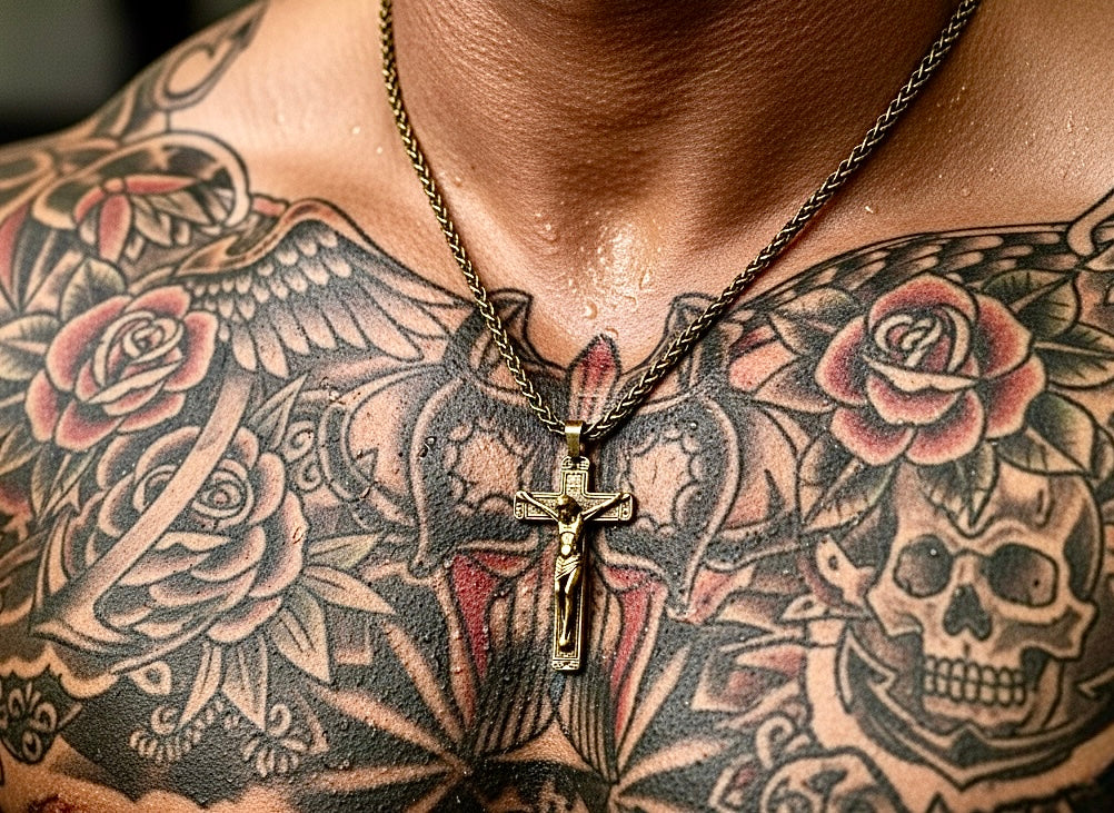 Bronze crucifix pendant necklace with heavy chain, worn on chest.