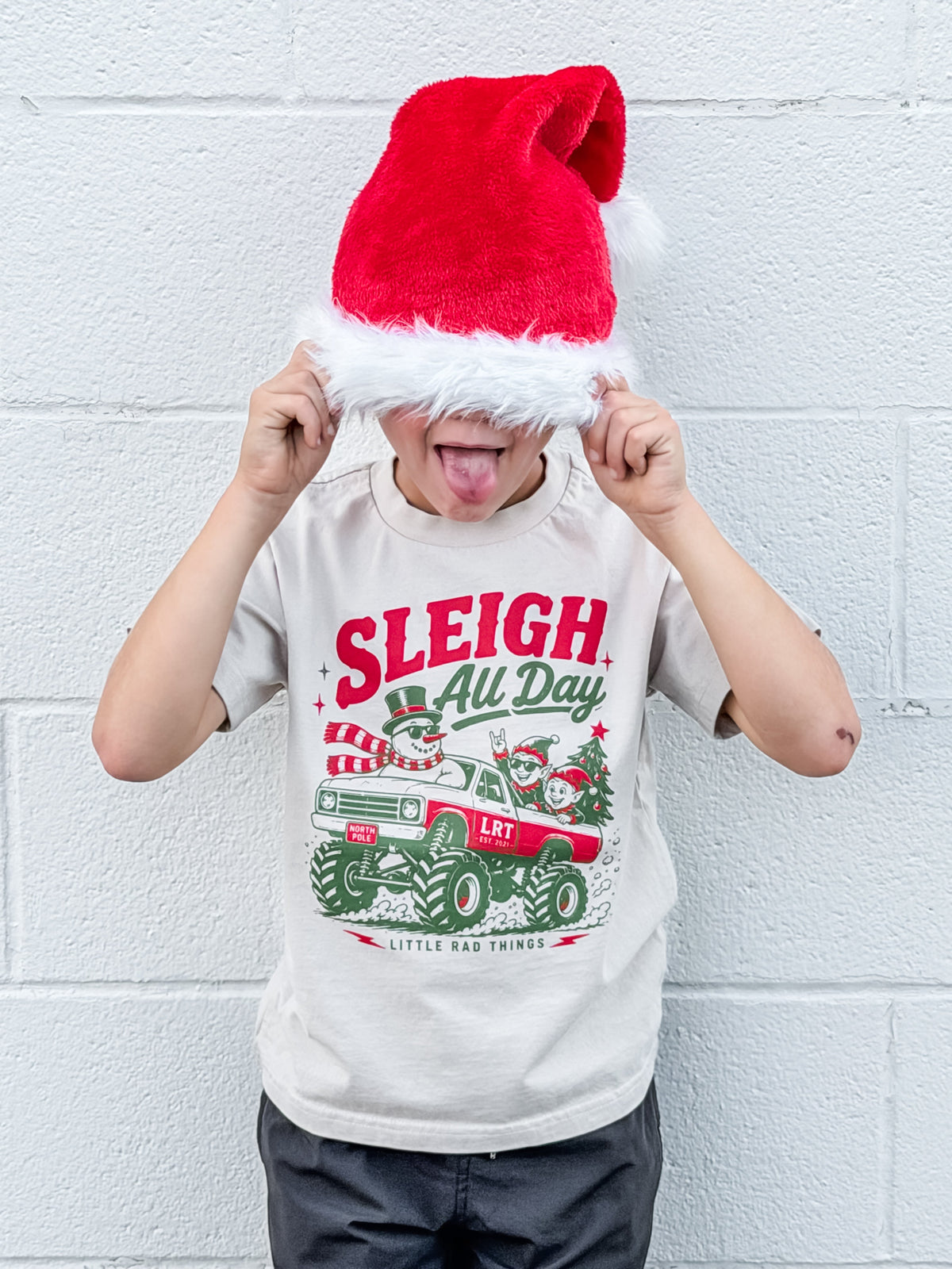White toddler Christmas t-shirt featuring “Sleigh All Day” monster truck print
