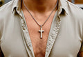 Stainless steel cross pendant necklace on silver chain
