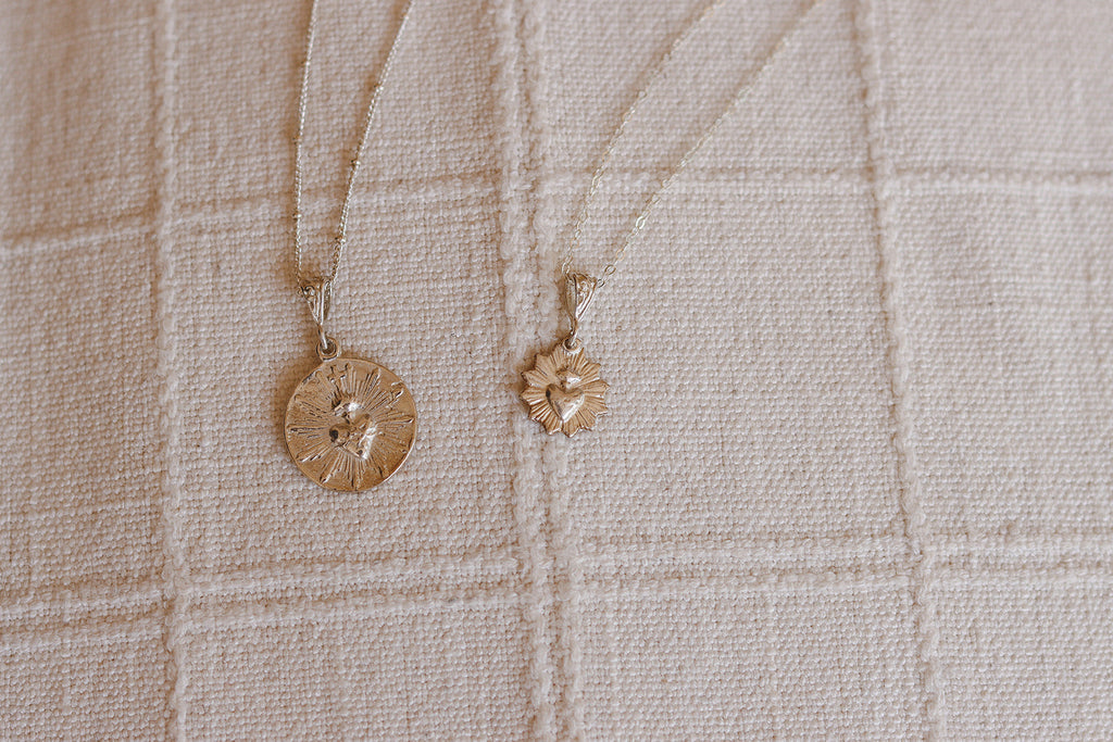 Silver necklace with small scalloped heart pendant on thin chain