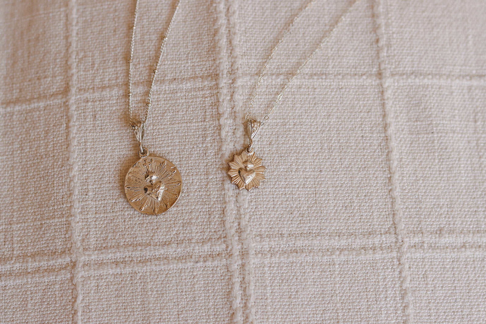 Silver necklace with small scalloped heart pendant on thin chain
