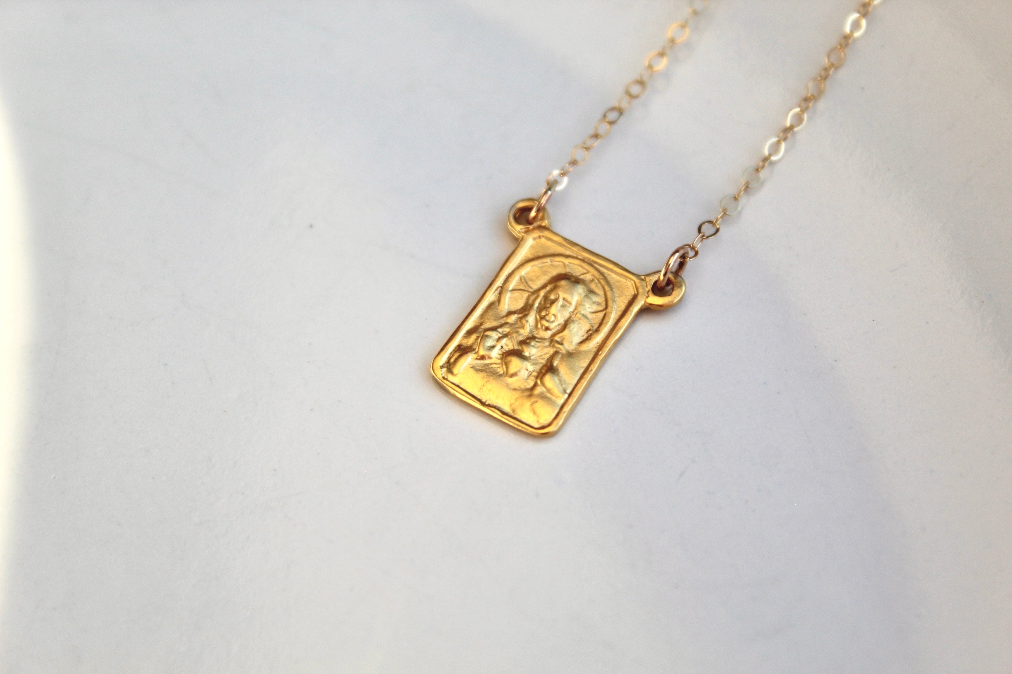 Gold scapular necklace with rectangular engraved charm on chain
