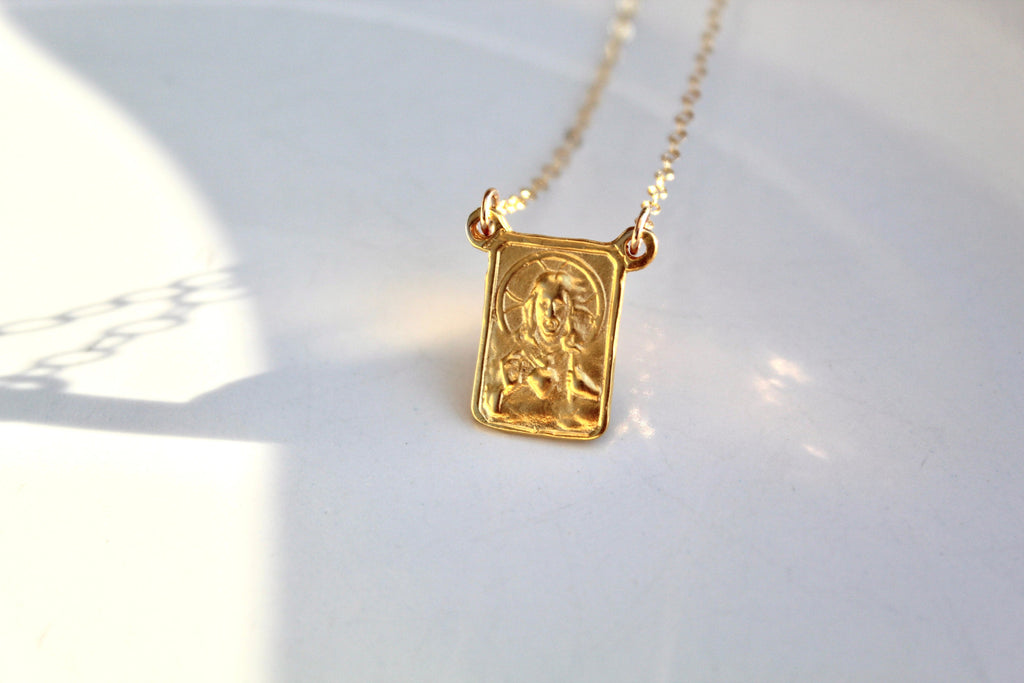 Gold scapular necklace with rectangular engraved pendant and chain