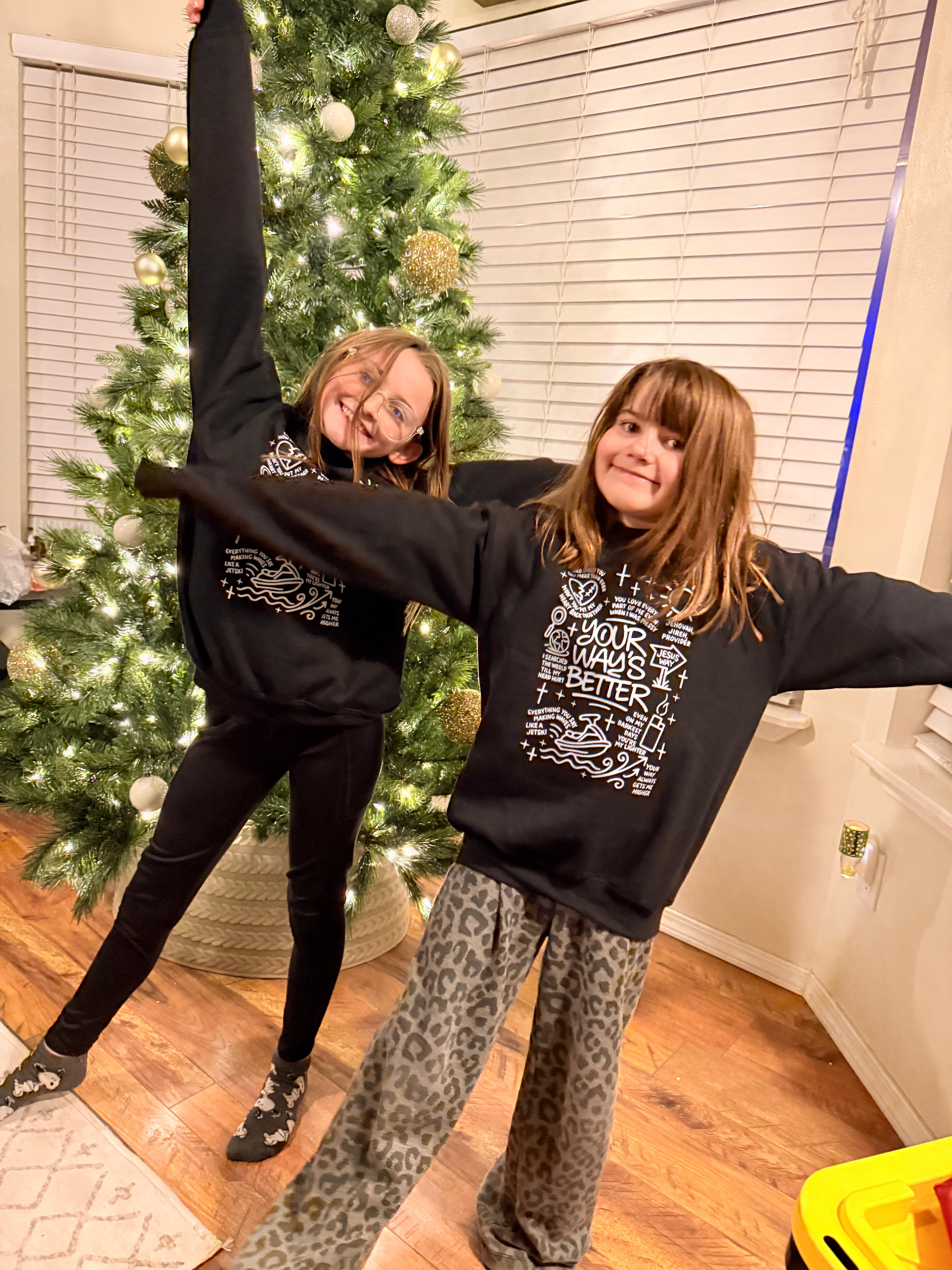 Black kids hoodie with front graphic print, hood, and long sleeves (two kids)