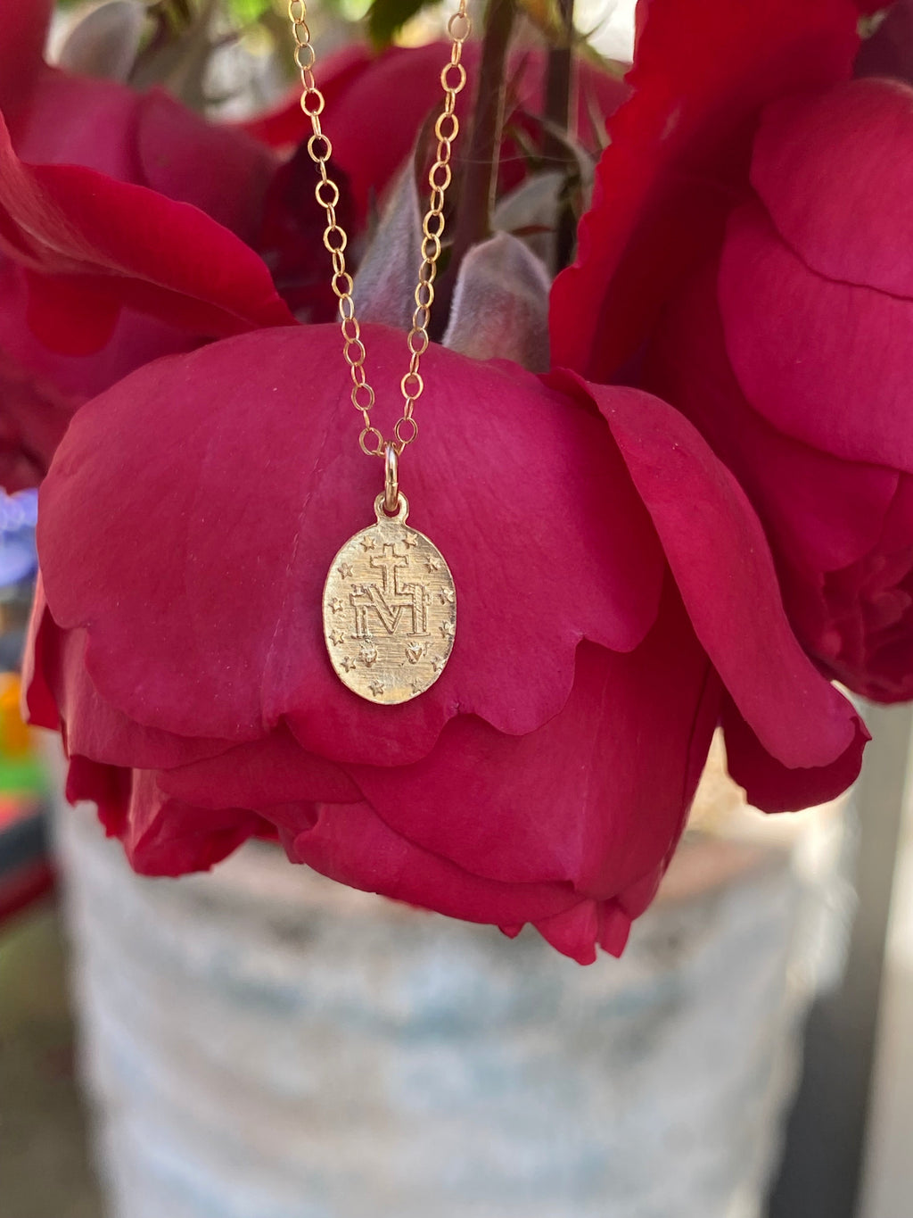 Gold-tone chain necklace with round religious medal pendant