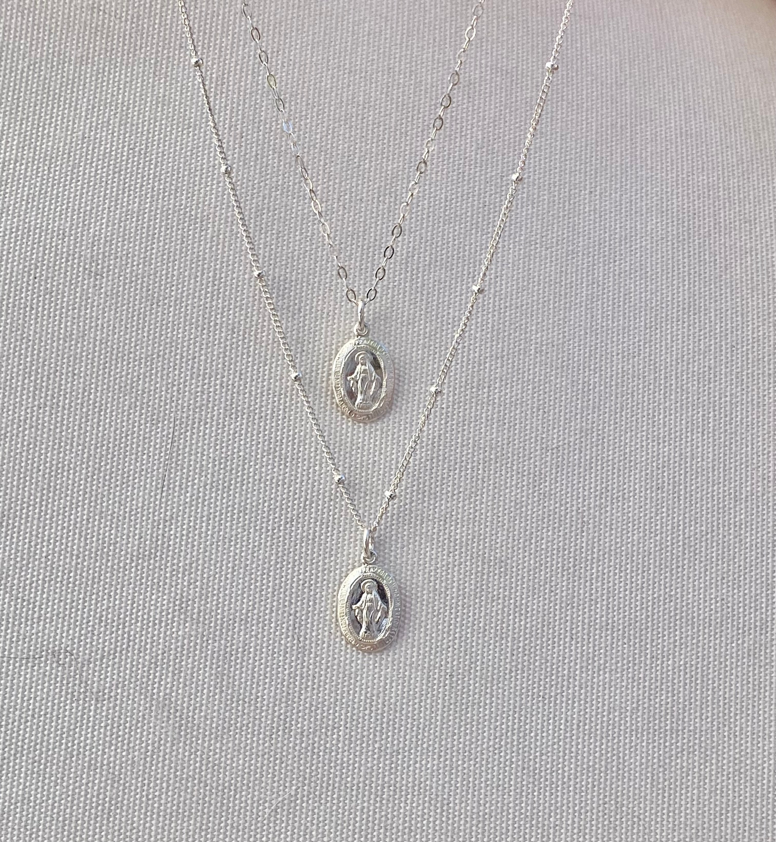 Silver miraculous medal necklace with two oval pendants on fine chain