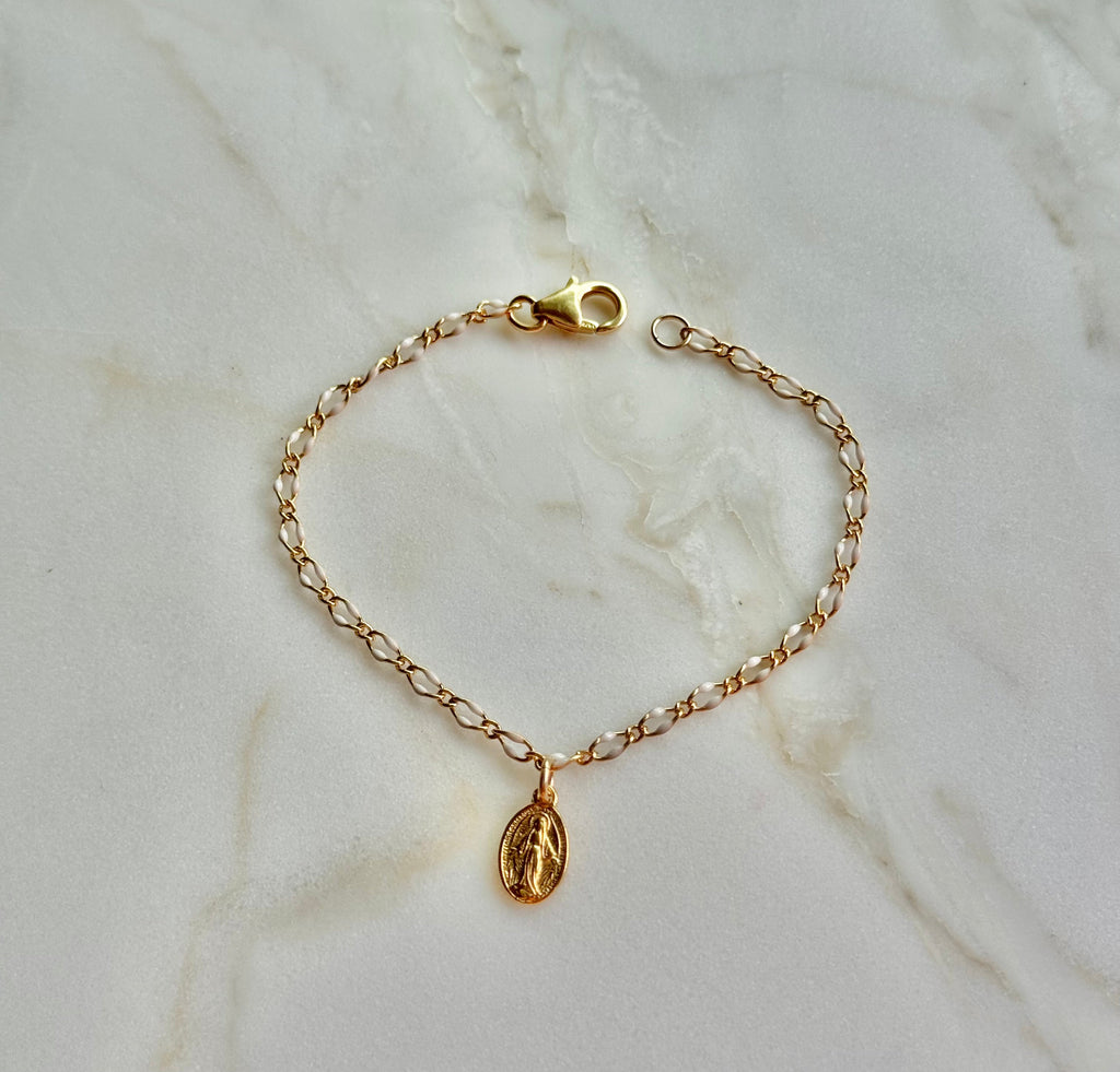 Gold chain bracelet with oval Miraculous Medal charm and toggle clasp