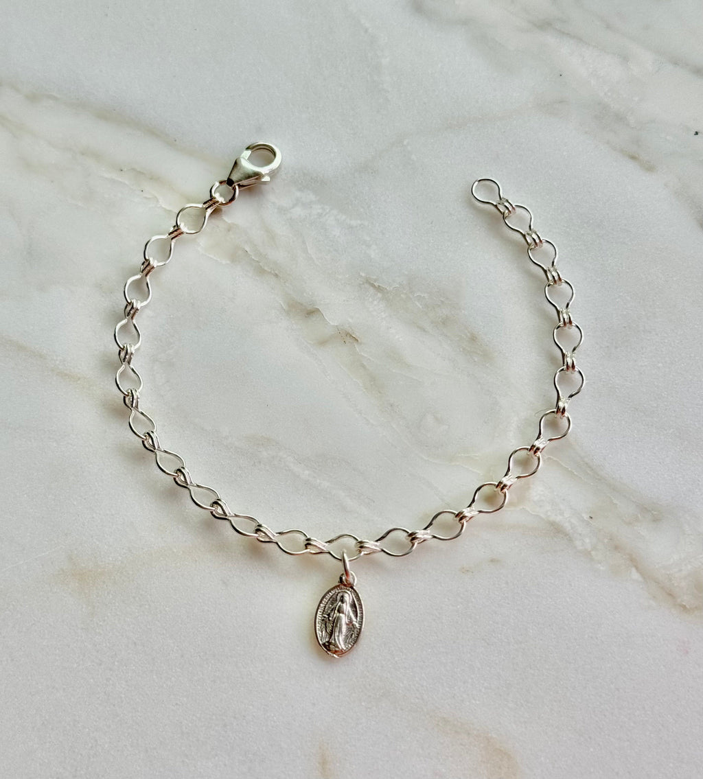Sterling silver charm bracelet with clasp and oval Marian medallion pendant