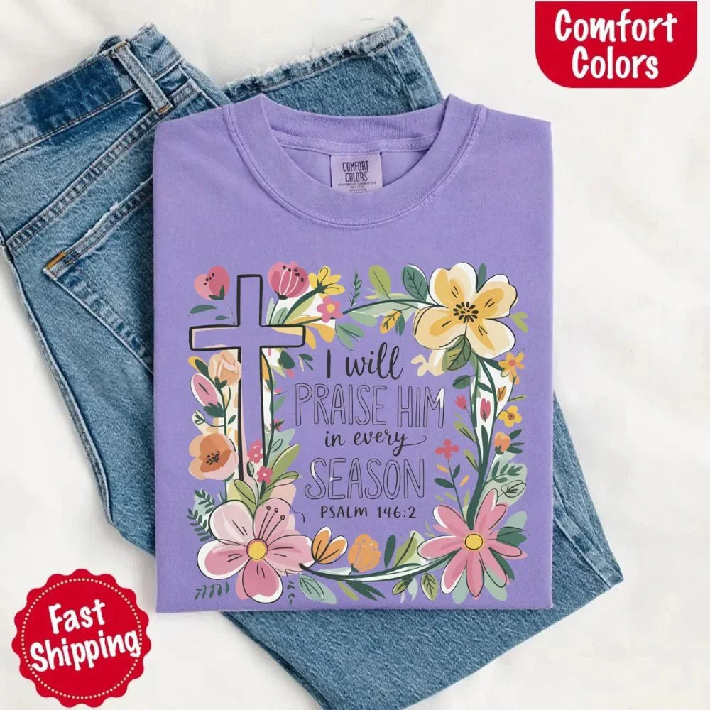 Purple crewneck tee with floral cross and flower frame, “I will praise Him in every season”