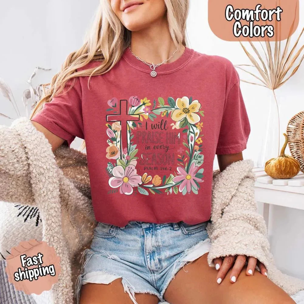 Burgundy crewneck tee with floral cross and flower frame, “I will praise Him in every season”