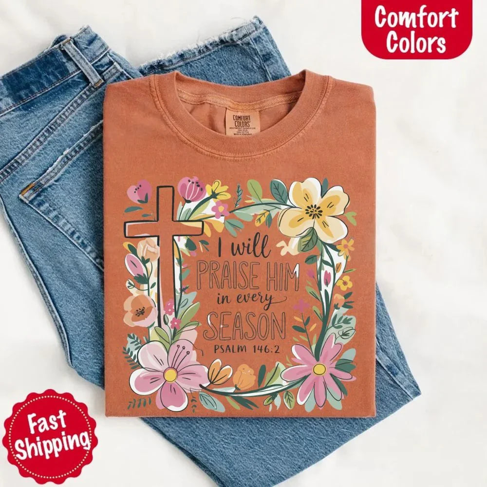 Rust brown comfort tee with floral cross frame and “I will praise him in every season” print