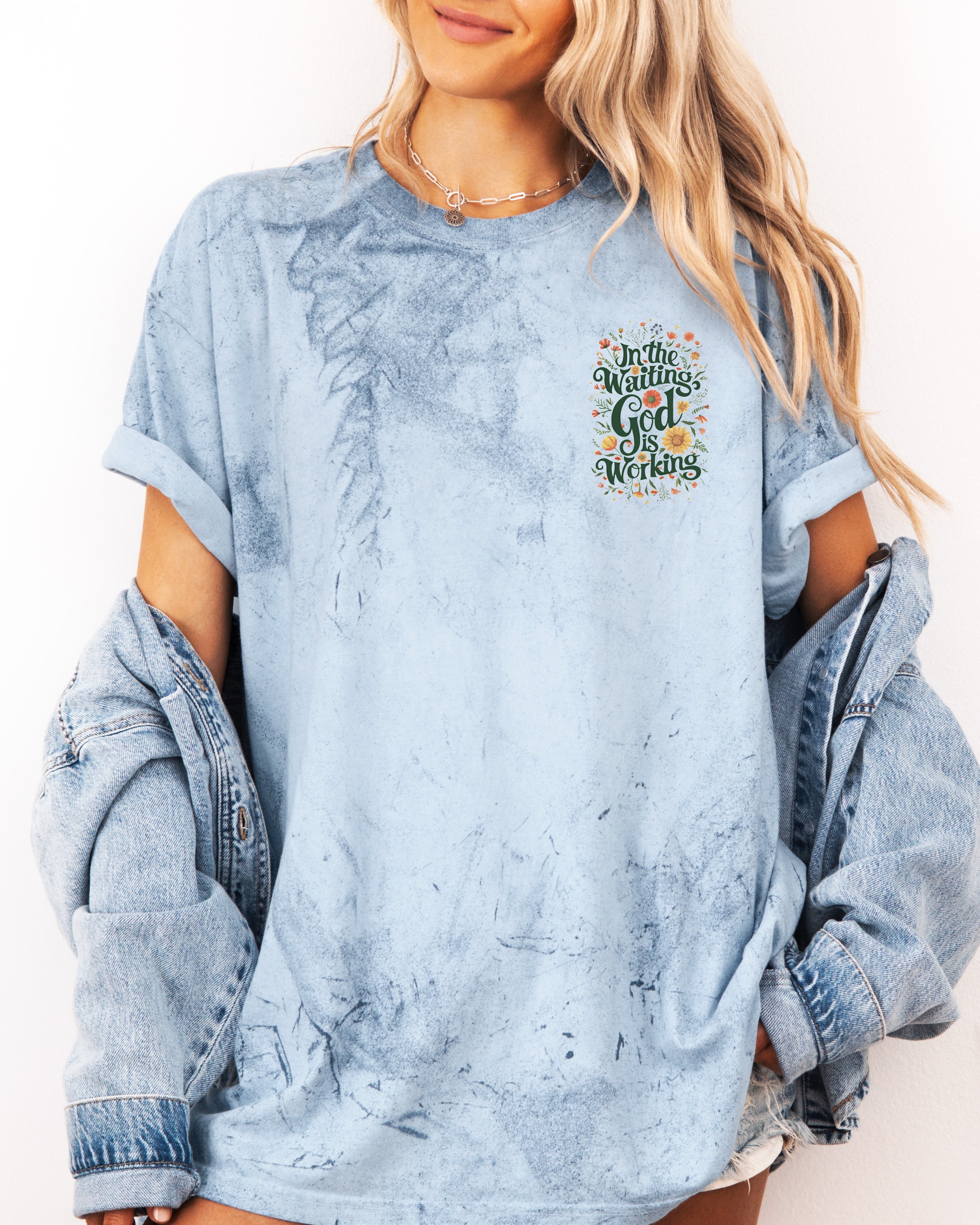 Light blue T-shirt with 'In The Waiting God Is Working' graphic on left chest