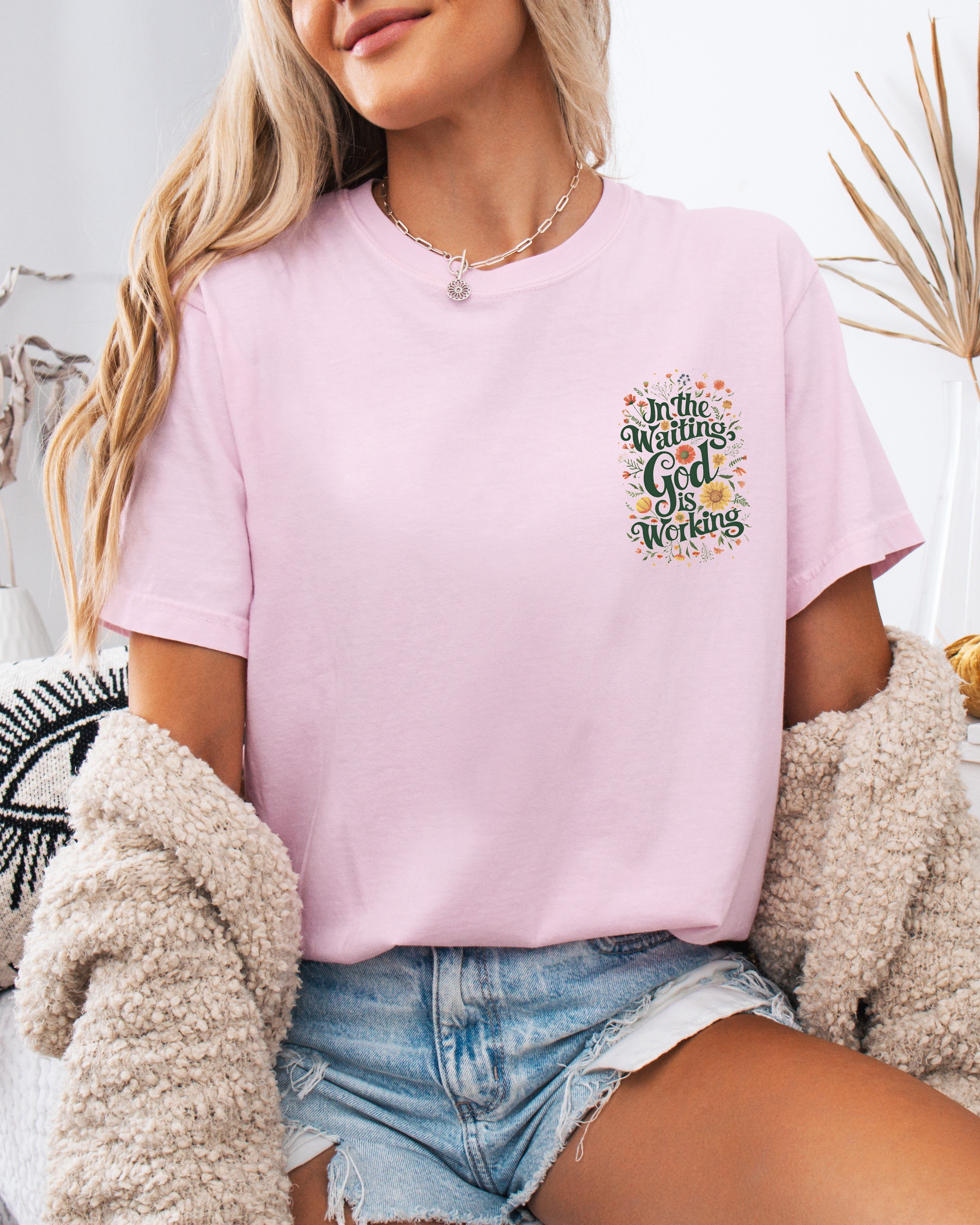 Orchid pink T-shirt with small 'In The Waiting God Is Working' graphic on left chest