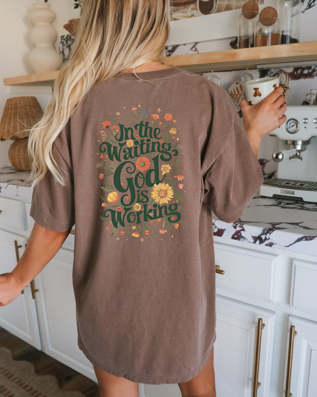 Espresso brown T-shirt with floral 'In The Waiting God Is Working' graphic on back