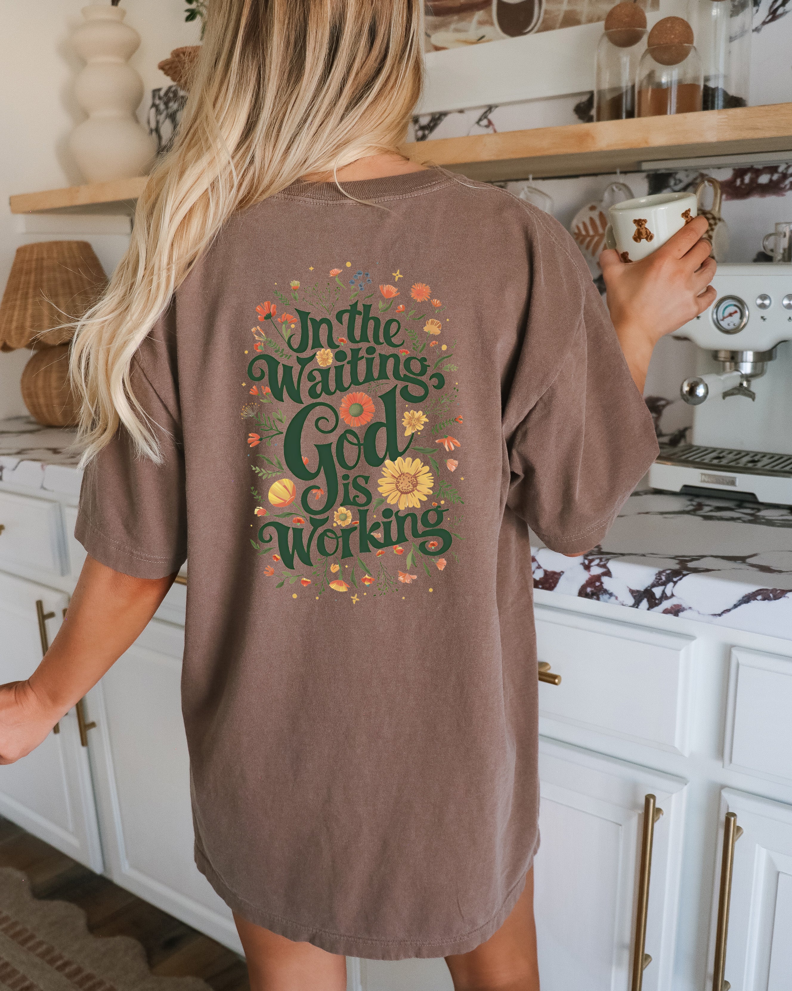Espresso brown T-shirt with floral 'In The Waiting God Is Working' graphic on back