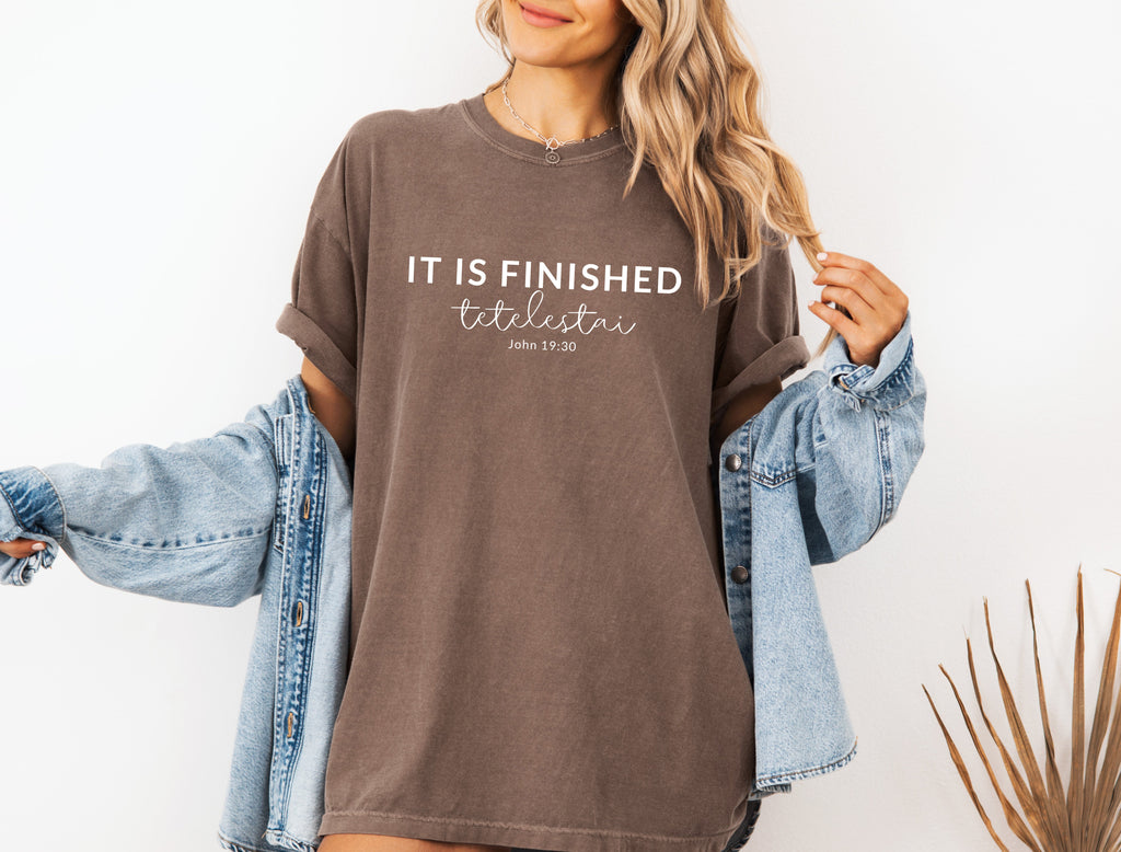 Unisex T-shirt, brown with “IT IS FINISHED” chest graphic and short sleeves