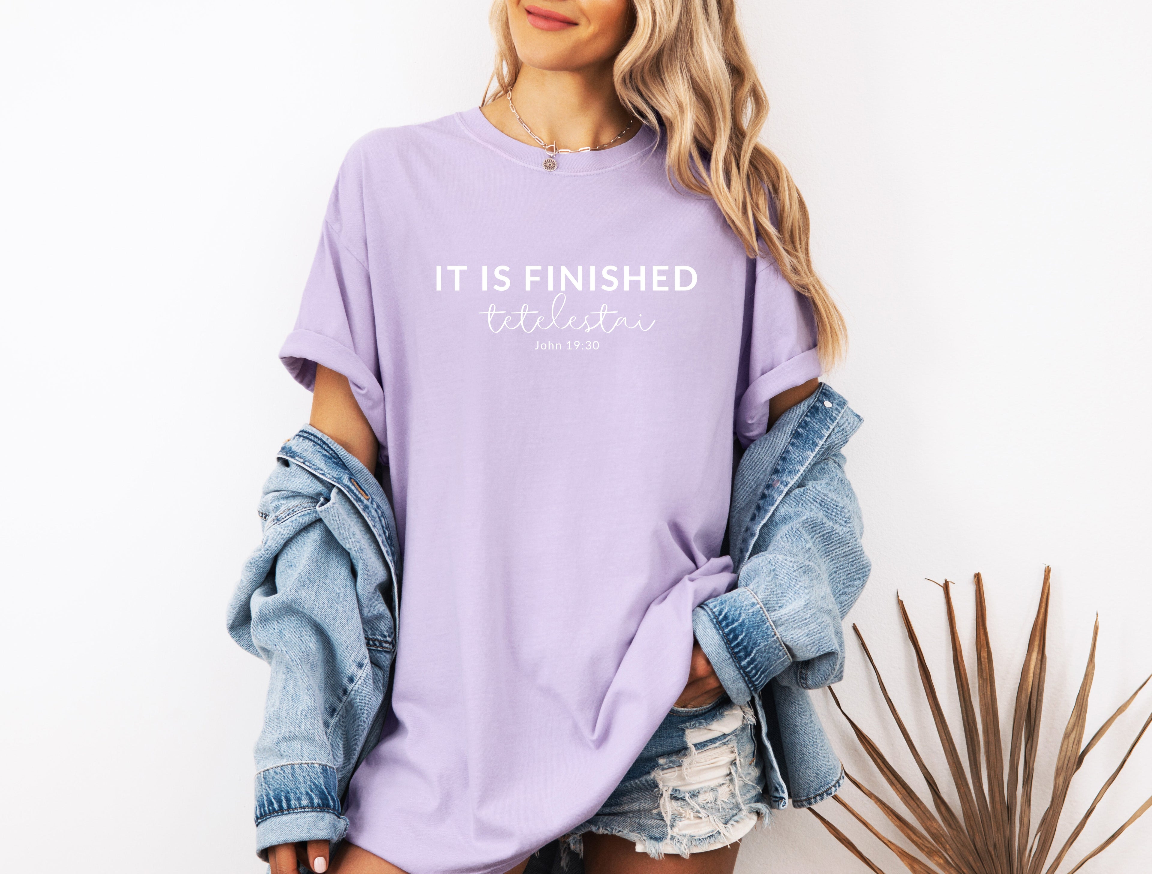 Unisex T-shirt, light purple with “IT IS FINISHED” chest graphic and short sleeves