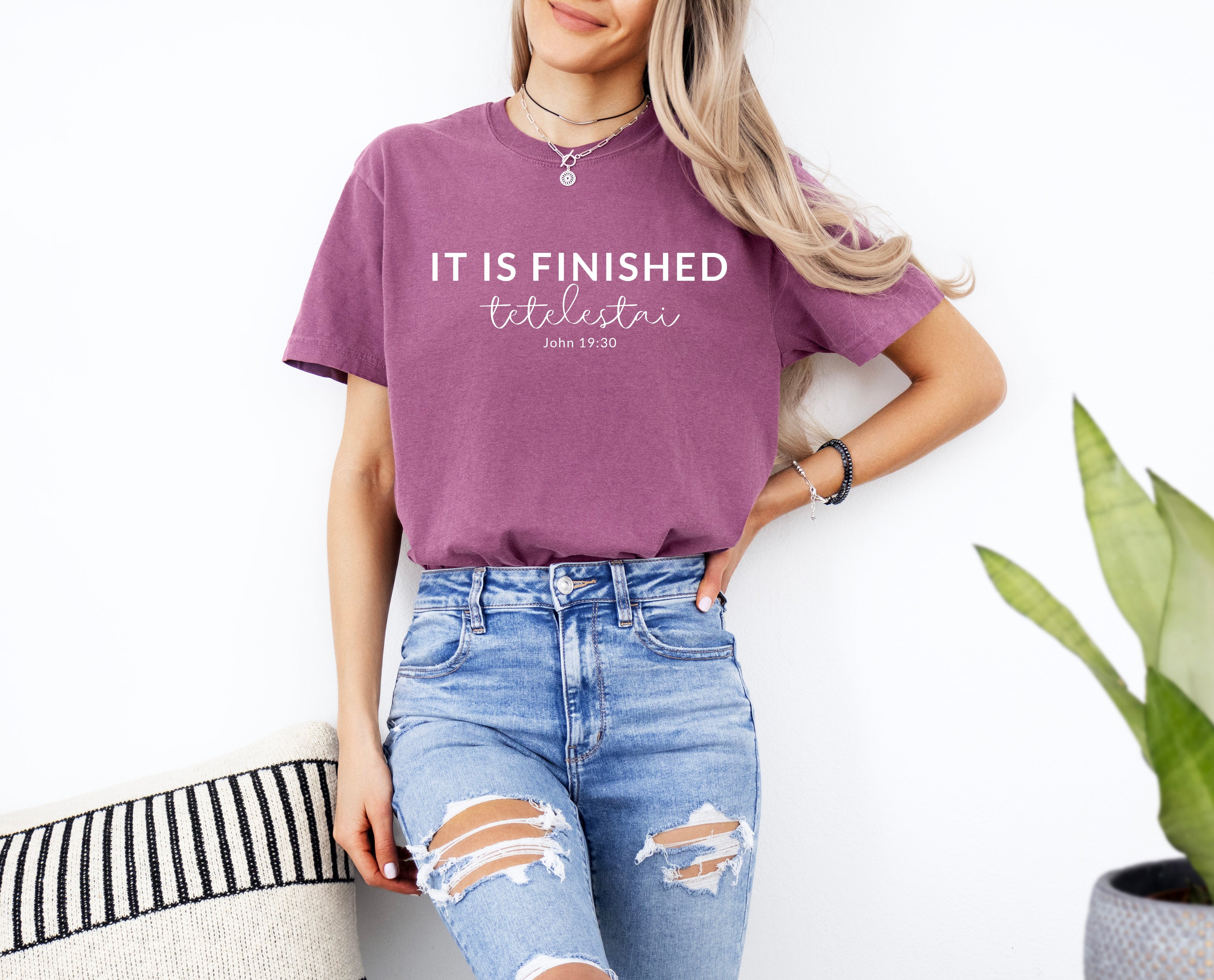 Unisex T-shirt, berry purple with “IT IS FINISHED” chest graphic and short sleeves
