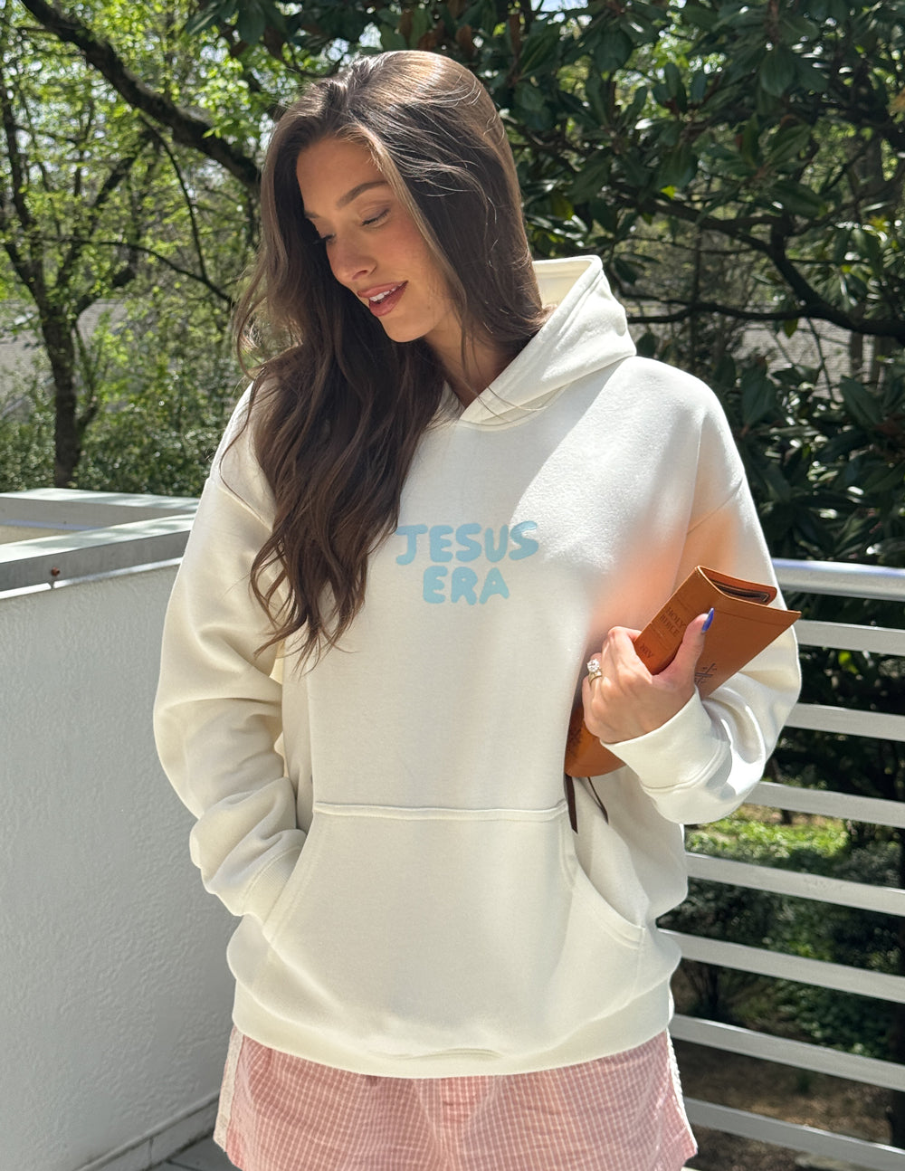 Off-white unisex hoodie with 'JESUS ERA' front print and attached hood