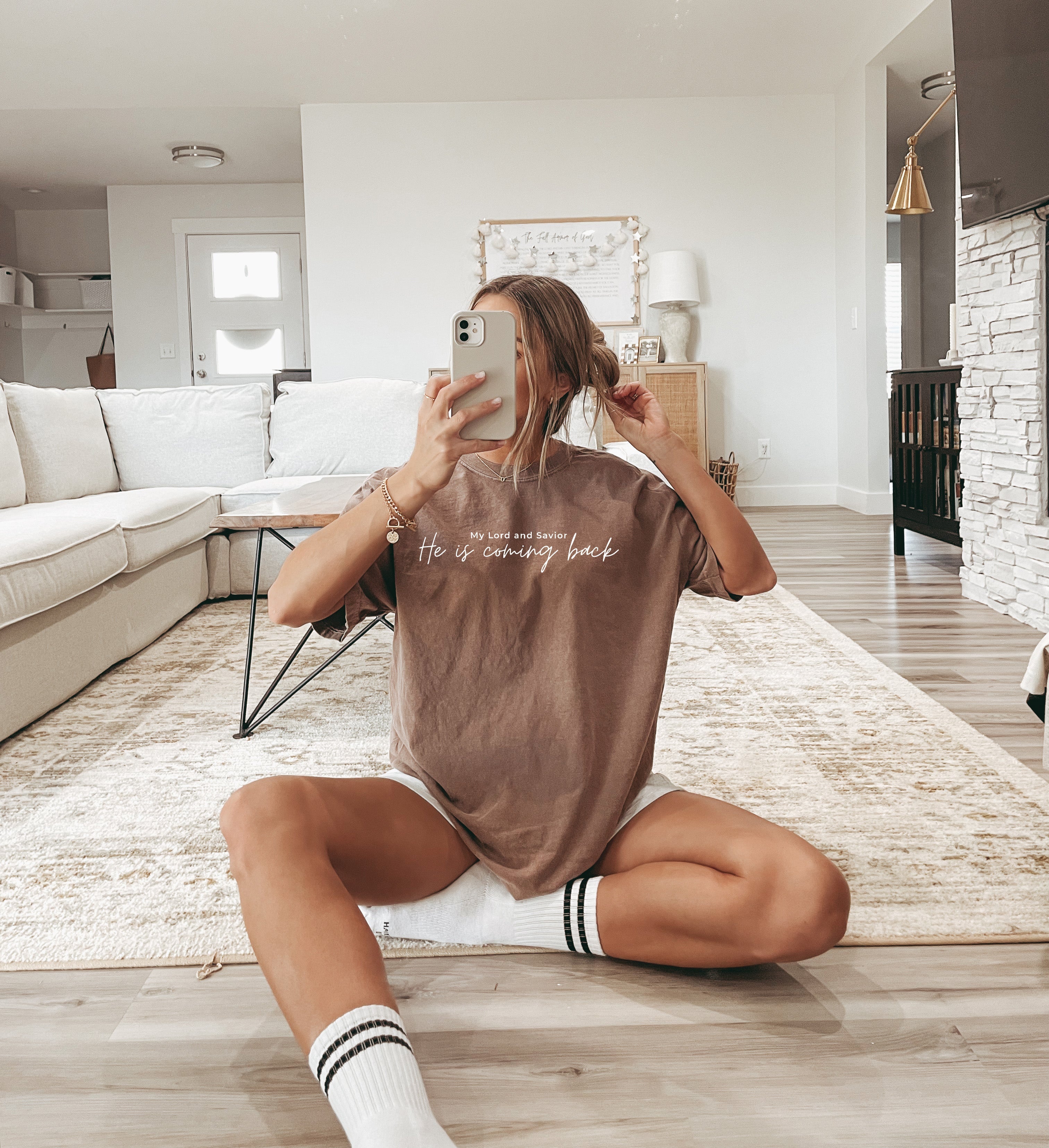 Brown T-shirt with white 'He is coming back' script on the front