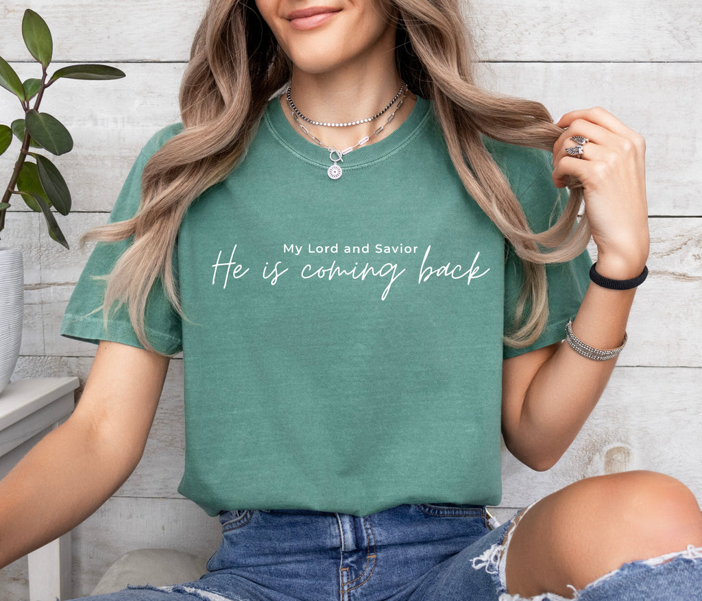 Green unisex t-shirt with script “He is coming back” and “My Lord and Savior” above