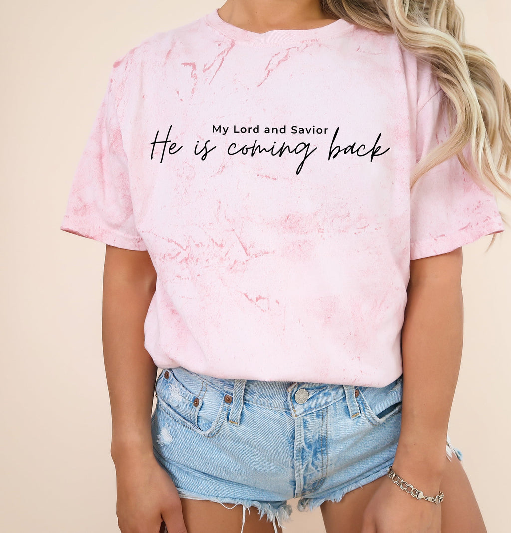 Pink marbled unisex t-shirt with script “He is coming back” and small “My Lord and Savior” text