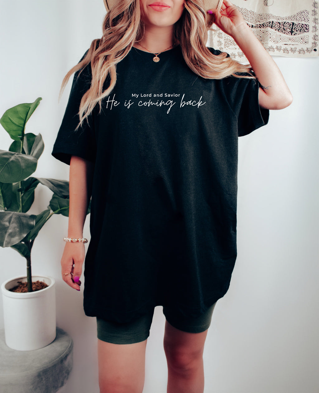Black unisex t-shirt with script “He is coming back” and “My Lord and Savior” above
