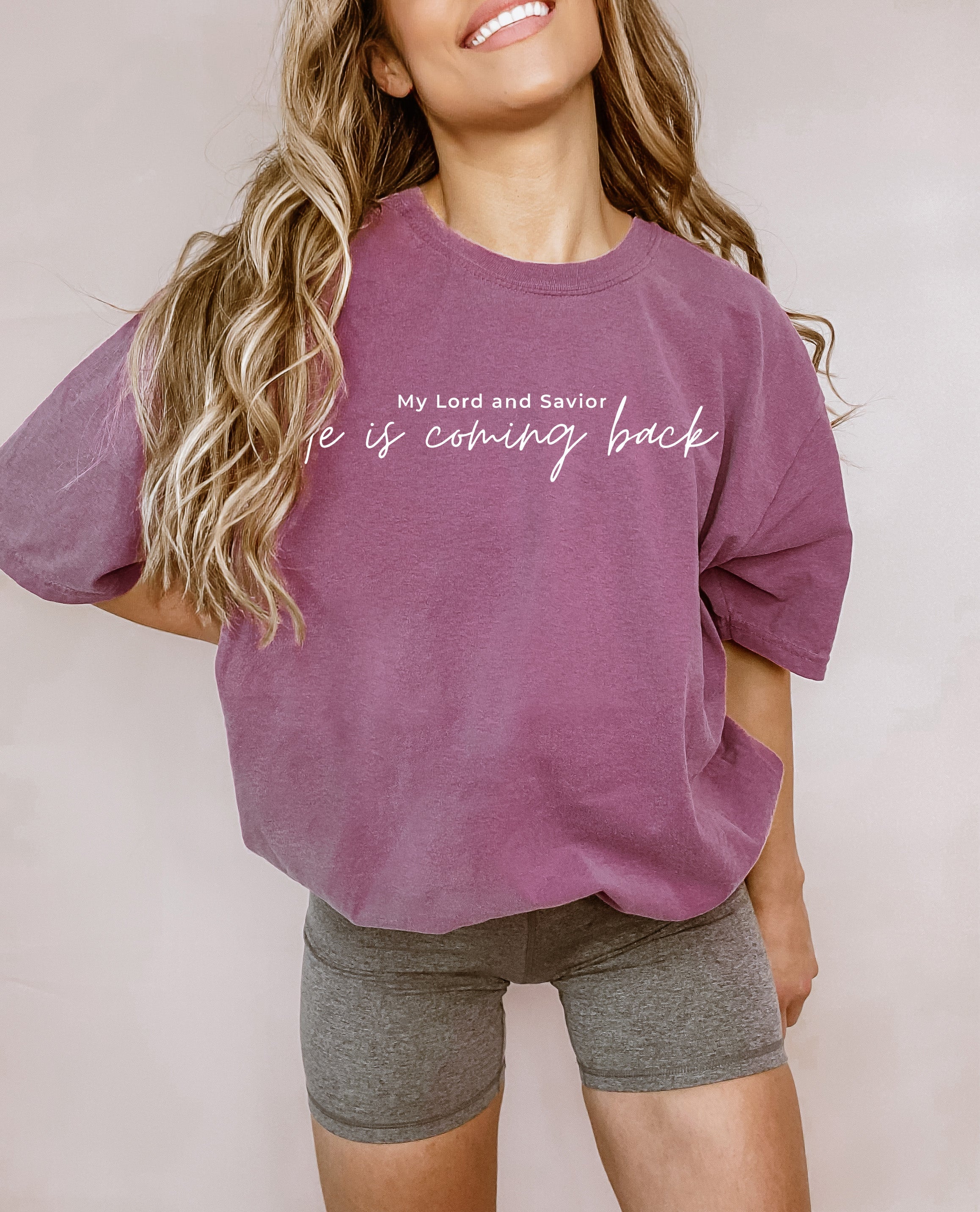 Dusty purple unisex t-shirt with script “He is coming back” and “My Lord and Savior” above